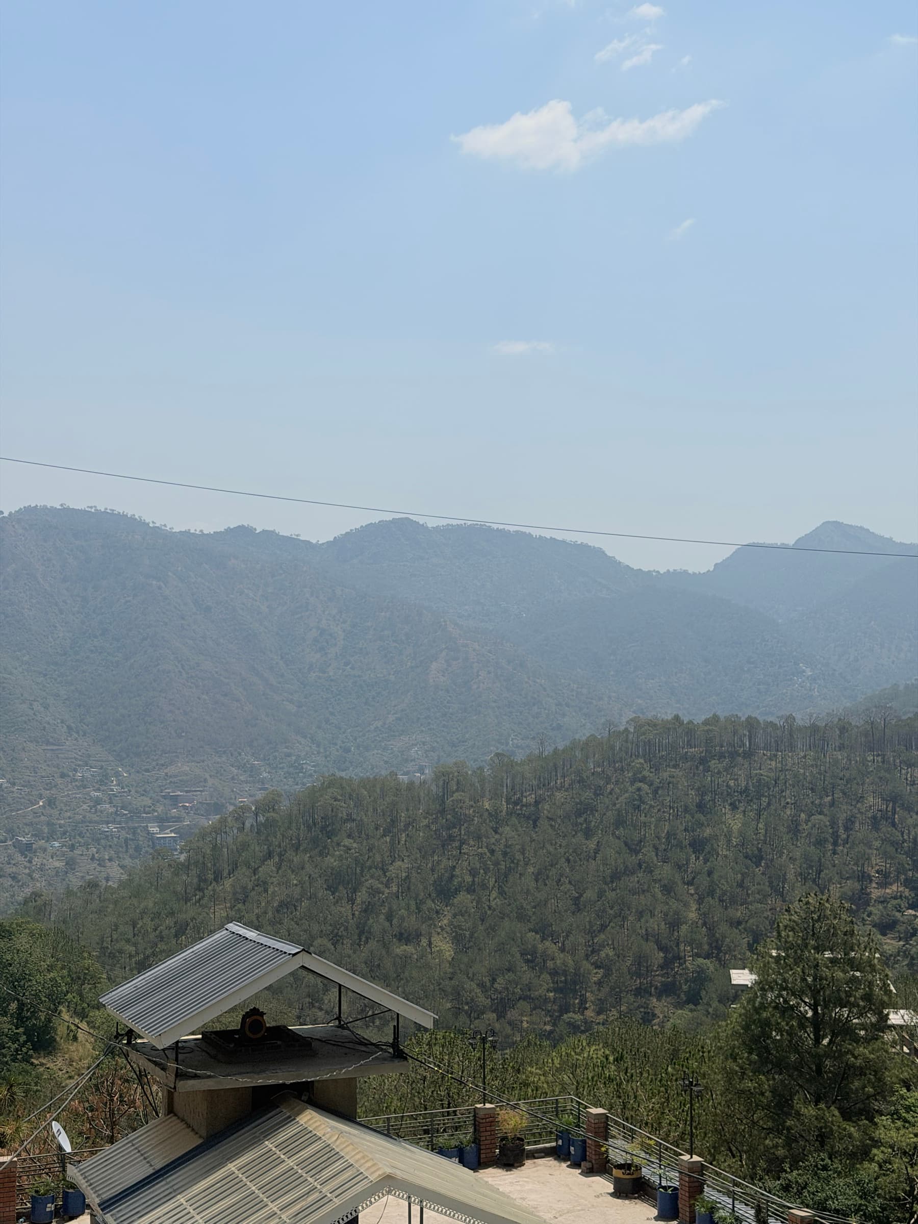 Wide valley view from the Wanderer Stays Hill Crest Kasauli apartment in Kasauli